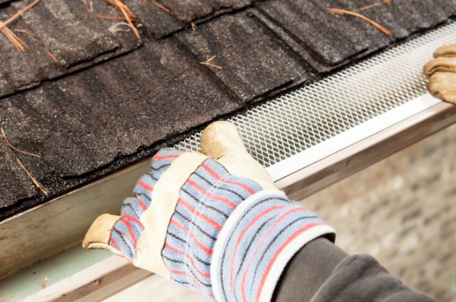 Bend Roof Gutter Guard being installed by a contractor